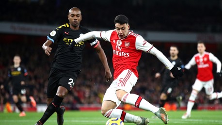 SKIPPER: Fernandinho keeps a close eye on Martinelli 