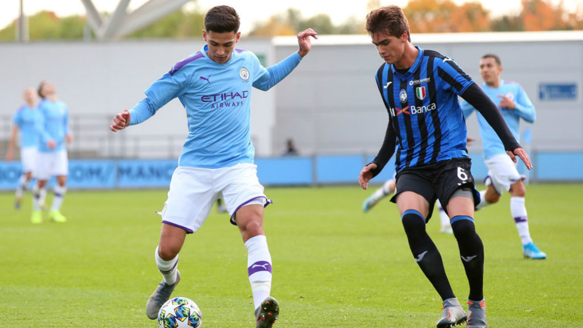 LEADING THE LINE: Nabil Touaizi drives at the Atalanta defence.