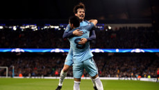 JUMP FOR JOY: Silva and Gundogan embrace after the German's strike