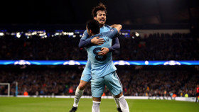JUMP FOR JOY: Silva and Gundogan embrace after the German's strike