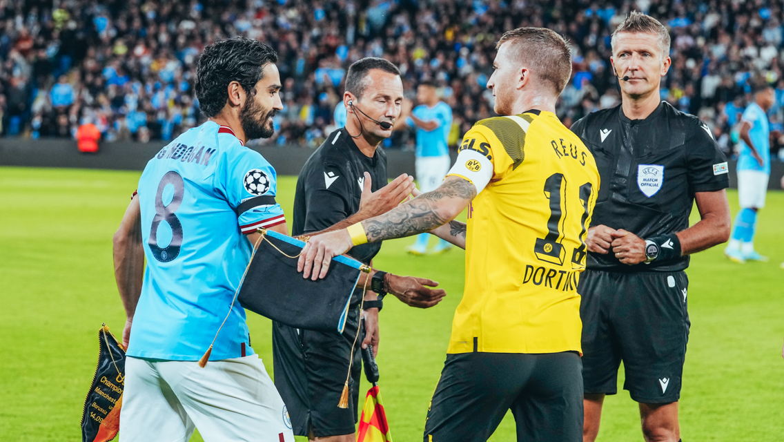 GAME TIME: Gundogan and Reus share a warm embrace - time to play!
