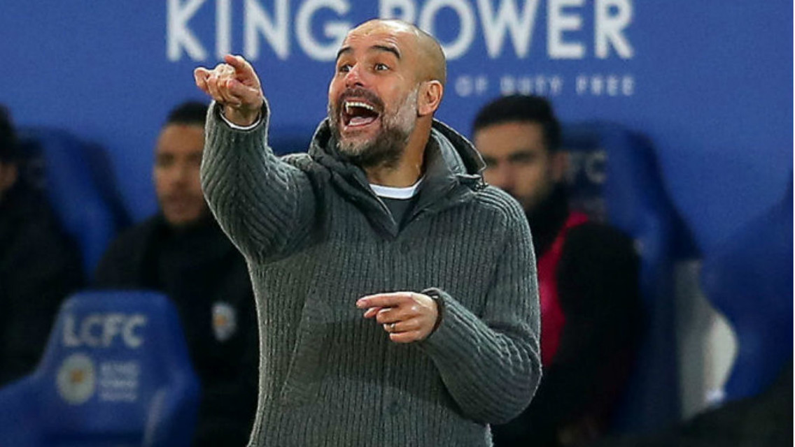 FESTIVE POINTER: Pep Guardiola passes on some intructions
