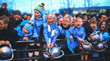 YOUNG AT ART: These excited City fans get ready to greet their heroes